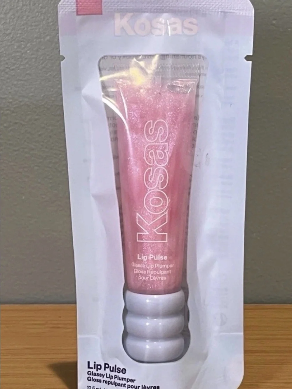Kosas Lip Pulse Glossy Lip Plumper — Aura Flare. New in sealed pack